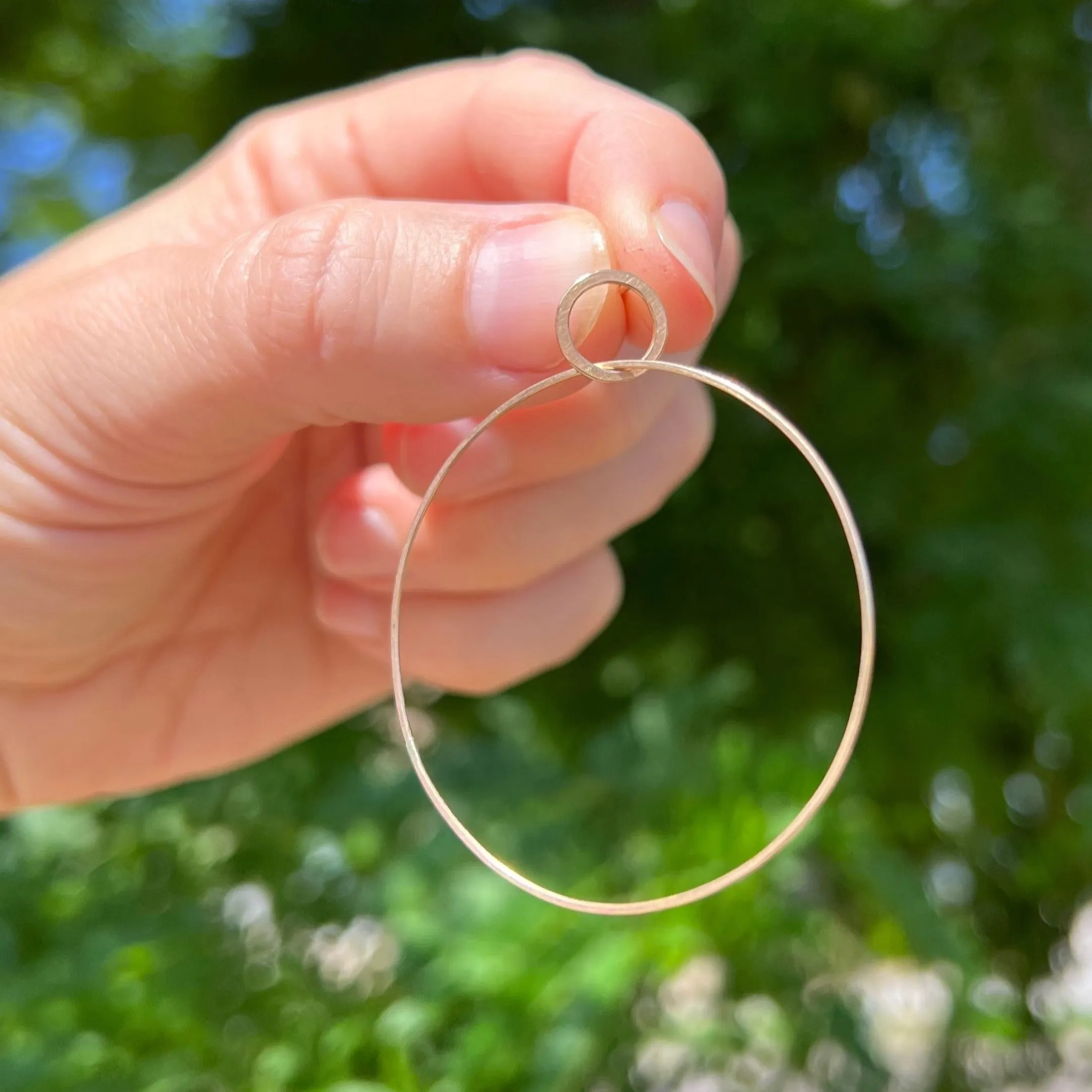 Large single hoop earrings in 18k gold